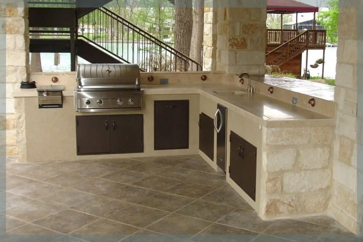 Photo of outdoor kitchen with travertine countertops. Travertine is one of the most classic types of stone countertops. 