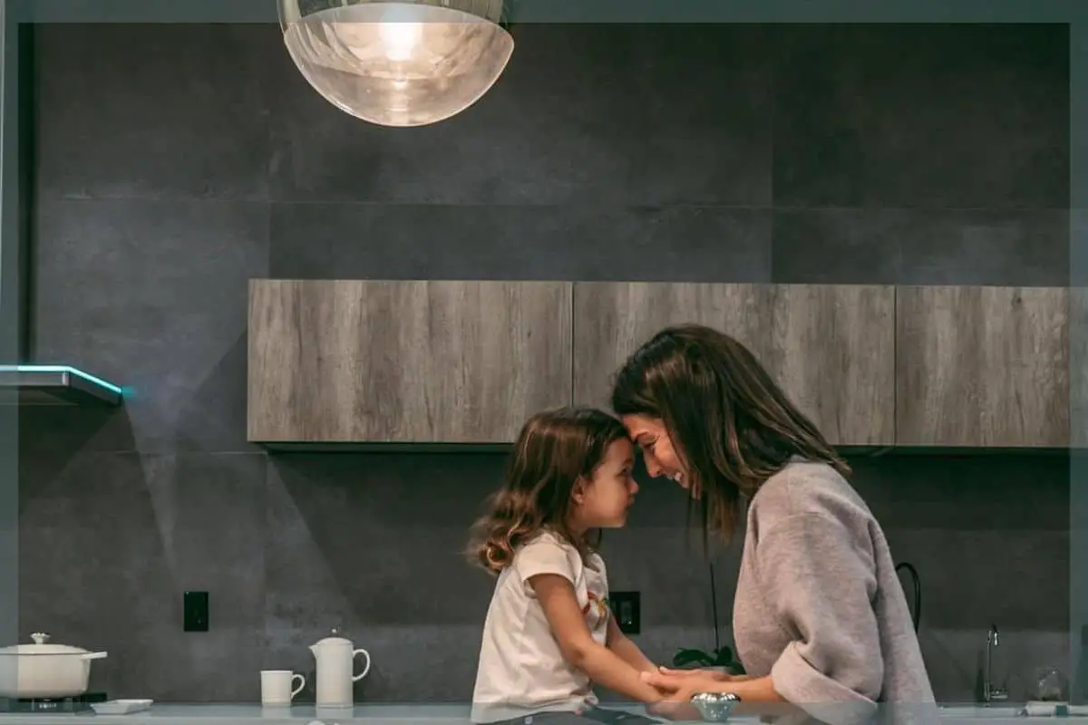 Photo of mom and daughter with the best kitchen countertops for families